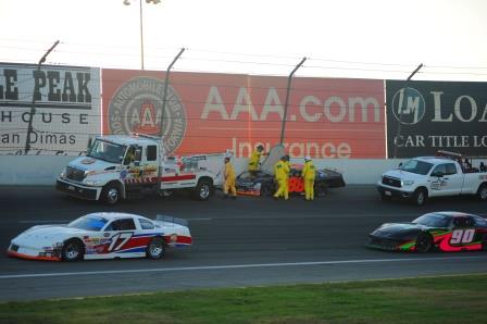 race cars on track getting towed